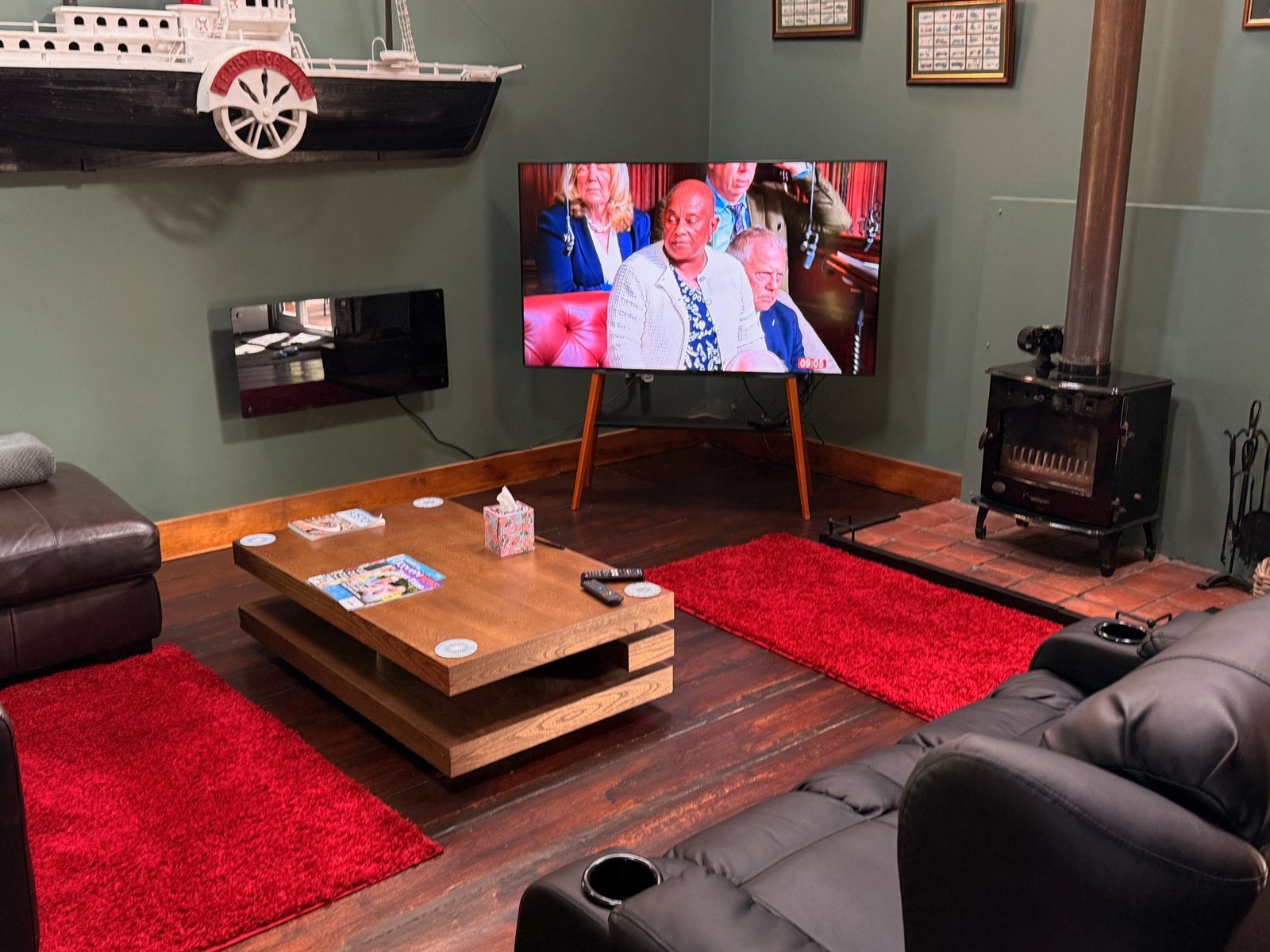 75 inch Smart TV with wood burner in the lounge at The Barn