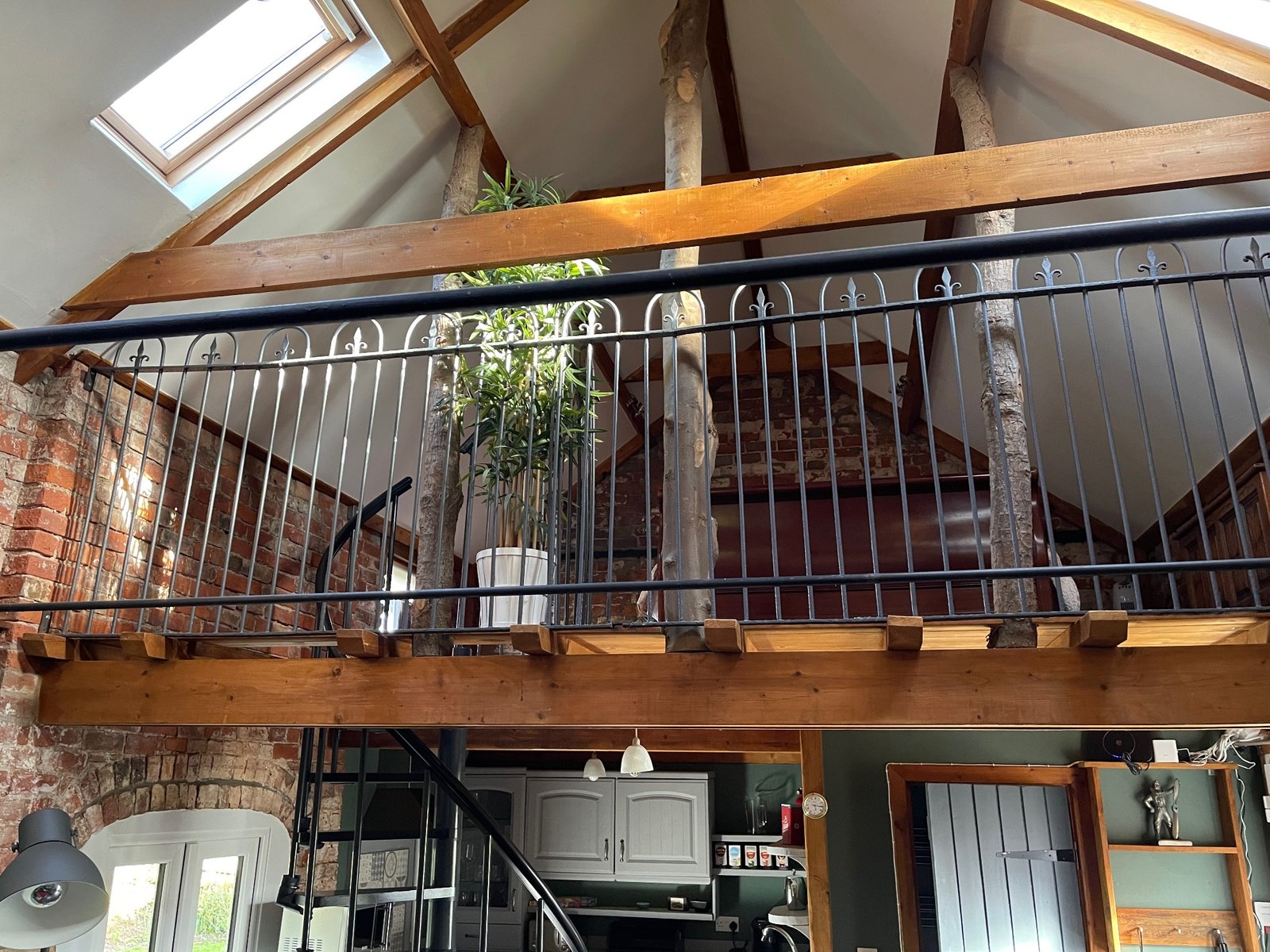 Vaulted barn interior with mezzanine bedroom